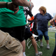 Contestants race to find a chair as the music stops during the Musical Chairs World Championship in Amesbury